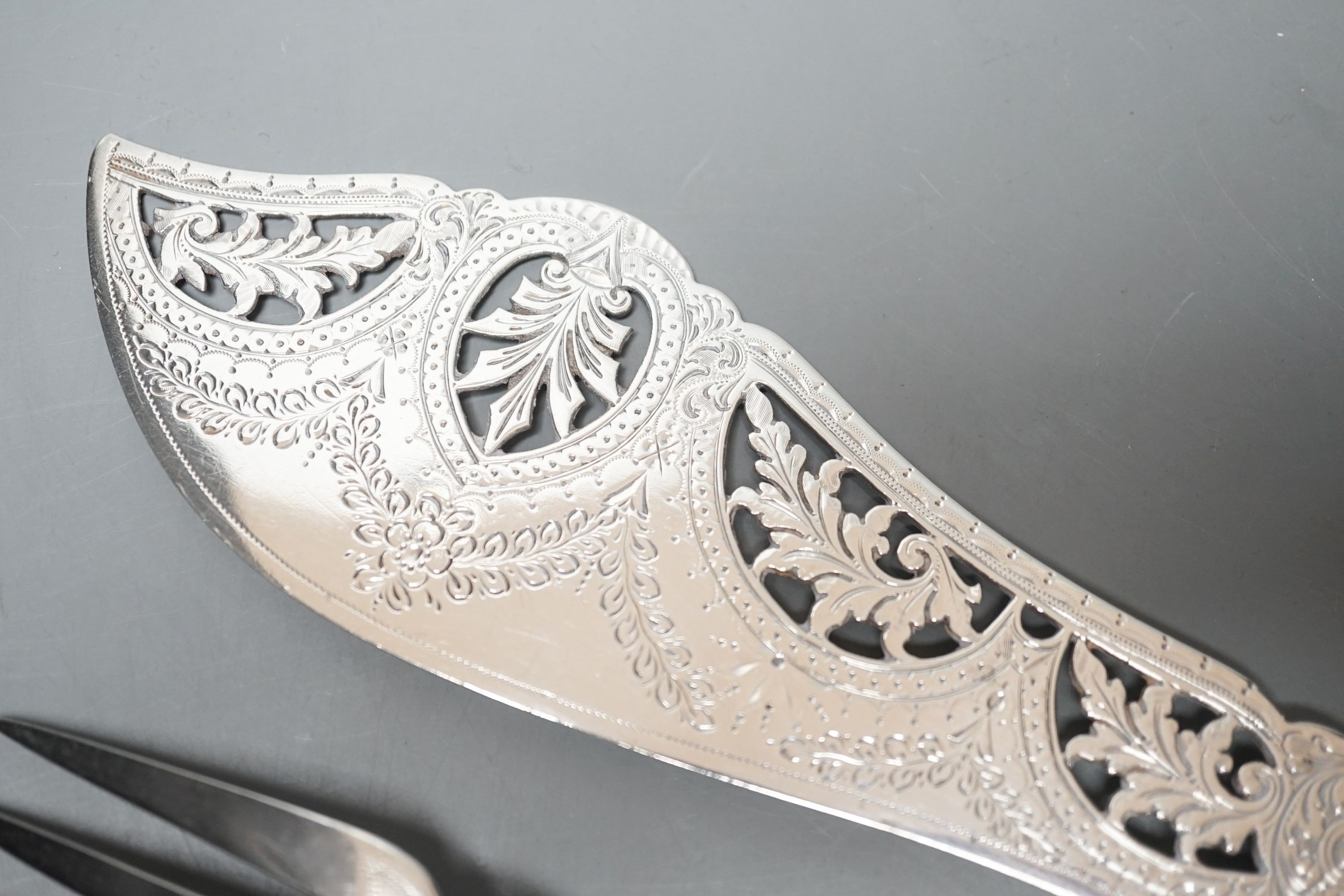 A pair of late Victorian ivory pistol handled silver fish servers, William Hutton & Sons, London, 1896, knife 33.2cm.